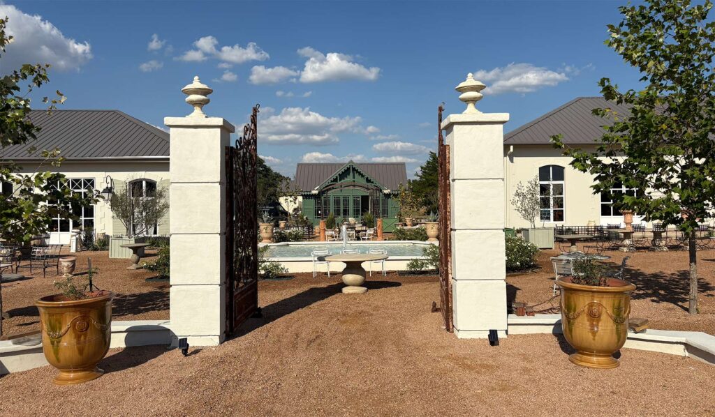 View of the front gate to Jardin de France 108 Compound Ln
