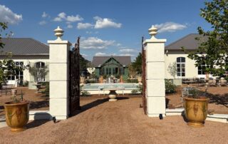 View of the front gate to Jardin de France 108 Compound Ln