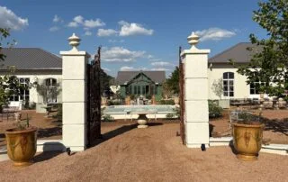 View of the front gate to Jardin de France 108 Compound Ln