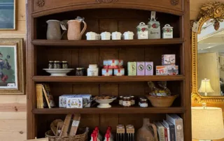 A close up of the hutch shelving stocked with French kitchenwares